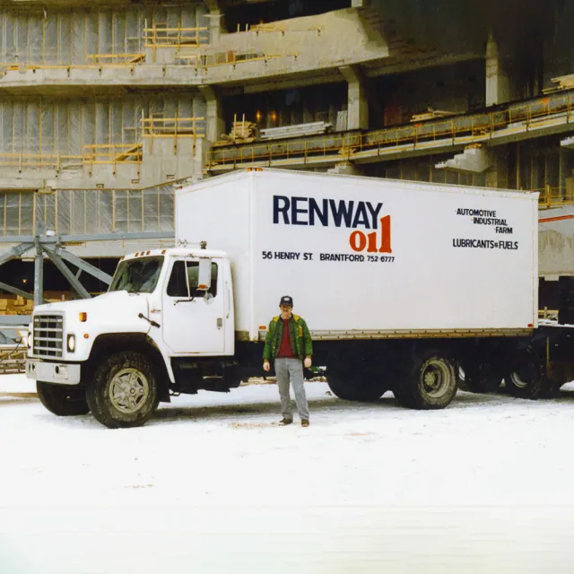 An early white Renway Oil box truck lettered 56 Henry St. Brantford, parked in the snow